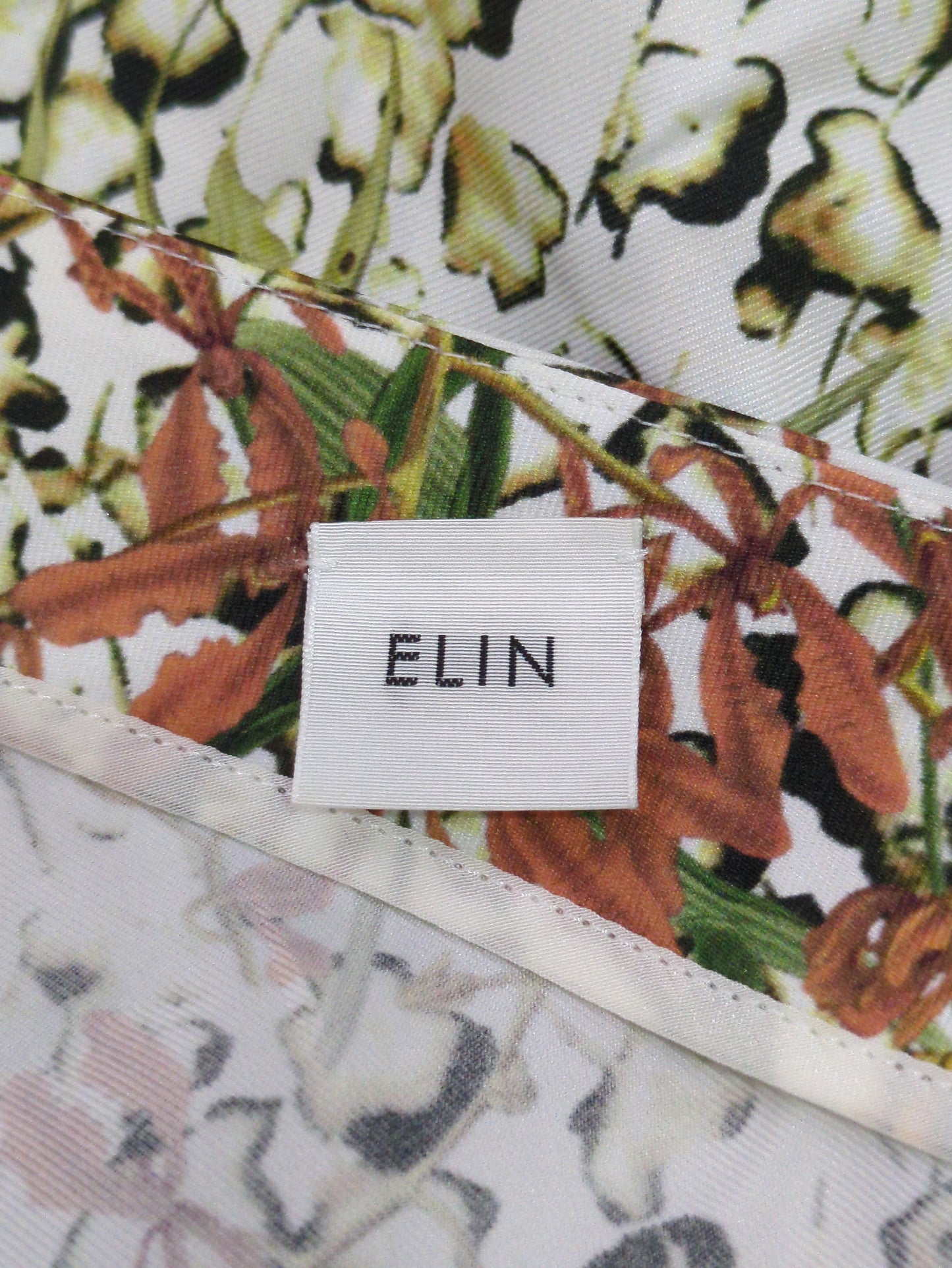 ELIN:PRINT ASYMMETRY TOPS